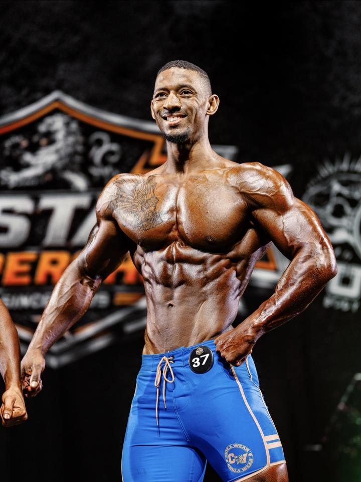 Eric Shelton on stage in men's physique